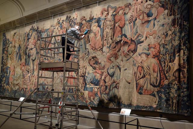 The tapestries in Chatsworth House sculpture gallery with conservator Susie Stokoe. Image by Brian Eyre