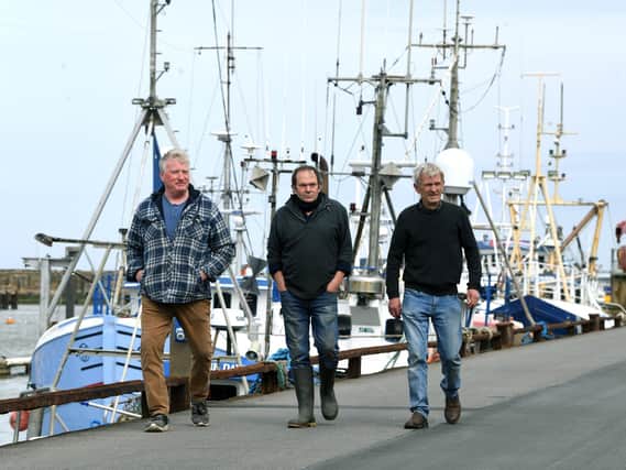 Fishermen, from left, Andrew Sanderson, Frank Powell and Shaun Wingham, pictured at Bridlington harbour. Picture: Jonathan Gawthorpe