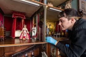 Sophie Bryan, Collections Assistant for the National Trust at Nostell Priory, taking great care to inspect the famous Dolls House before cleaning.