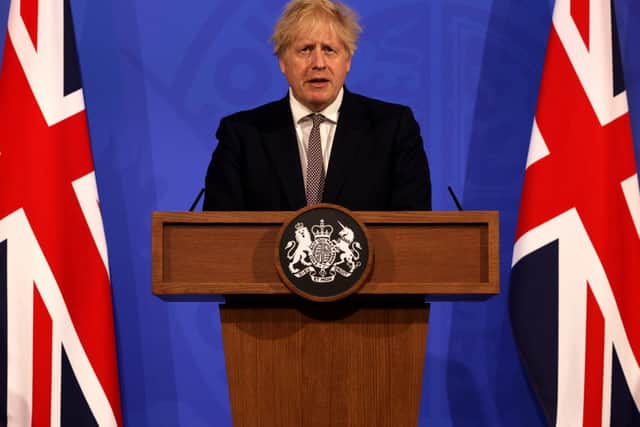Britain's Prime Minister Boris Johnson attends a virtual press conference to announce changes to lockdown rules in England at Downing Street. Photo credit: Getty Images