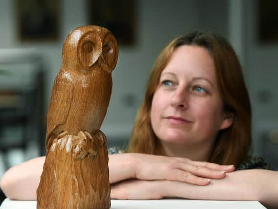 Diane Sinnott with the Mouseman owl carving