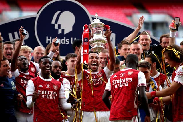 WINNERS: Arsenal's Pierre-Emerick Aubameyang (centre) and team-mates celebrate with the FA Cup trophy after beating Chelsea at Wembley last year. Picture:  Adam Davy/PA.