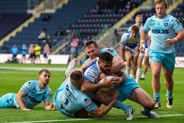 Leeds Rhinos' Rhyse Martin barges over for his try. (BRUCE ROLLINSON)