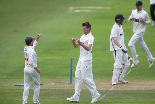 Glamorgan bowler Michael Hogan celebrates skittling the off stump of Yorkshire batsman Tom Kohler-Cadmore, right, during day two at Sophia Gardens. Picture: Nick Potts/PA