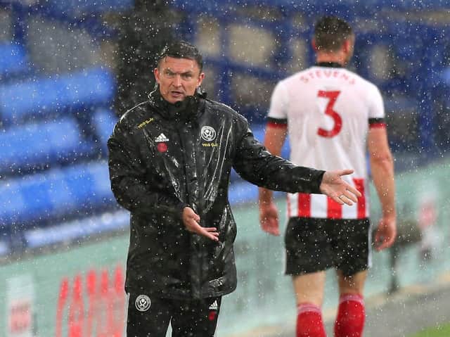 Sheffield United interim manager Paul Heckingbottom pictured in the incessant rain at Goodison Park.