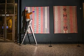 Exhibition assistant Catherine Dickinson with a quilt made by Hannah Hauxwell's grandmother Elizabeth Bayles is to feature in a new exhibition having been secured at auction by the Bowes Museum in Barnard Castle.  Picture Tony Johnson