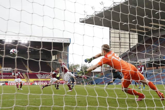 On target: Mateusz Klich bends the ball around Ben Mee and past Bailey Peacock-Farrell of Burnley. Picture: Sportimage
