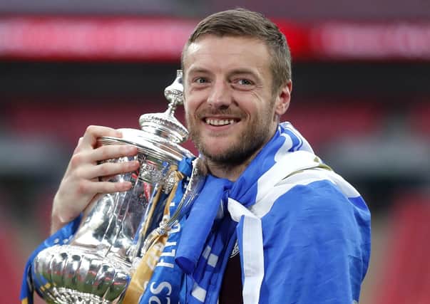 Leicester City's Jamie Vardy celebrates with the trophy.