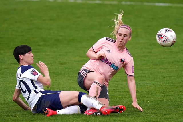 Tottenham Hotspur's Lucy Quinn (left) and Sheffield United's Bex Rayner compete for the ball.