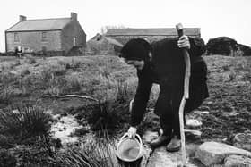 Hannah Hauxwell drawing her water for domestic use at her farm in Baldersdale in the early 1980s
