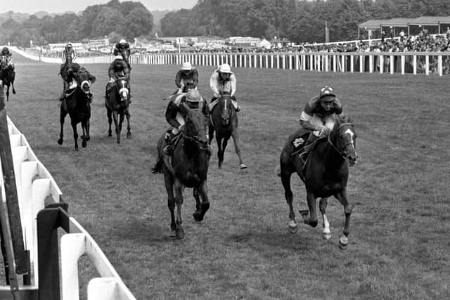 File photo dated 26-07-1975 of Grundy ridden by Pat Eddery comes home to win the King George VI and Queen Elizabeth Diamond Stakes, ahead of Bustino ridden by Joe Mercer (left).