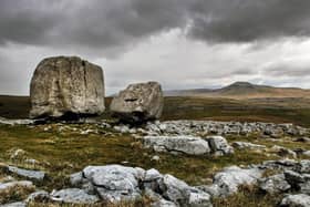 The Cheese Press stone above the limestone escarpment of Kingsdale north of Ingleton looking towards Ingleborough. Picture: Bruce Rollinson