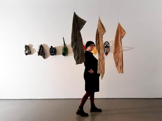 The curator with work by Andrea Zittel.