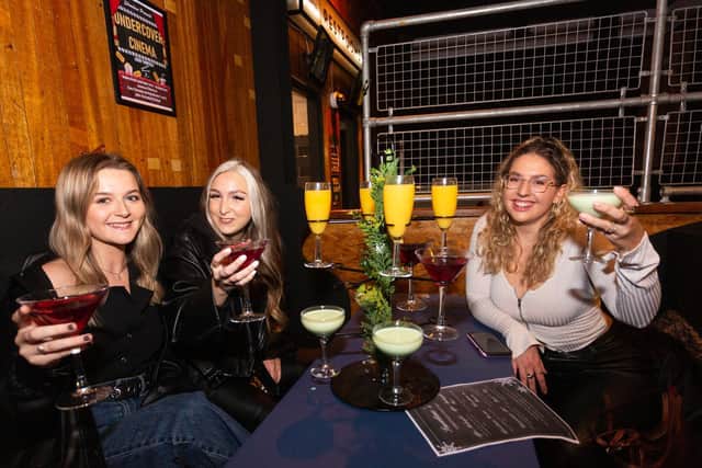L-R Rosie Delaney, Isobel Logan and Rebecca Mitchell enjoy a cocktail at Showtime Bar, in Huddersfield. (SWNS)