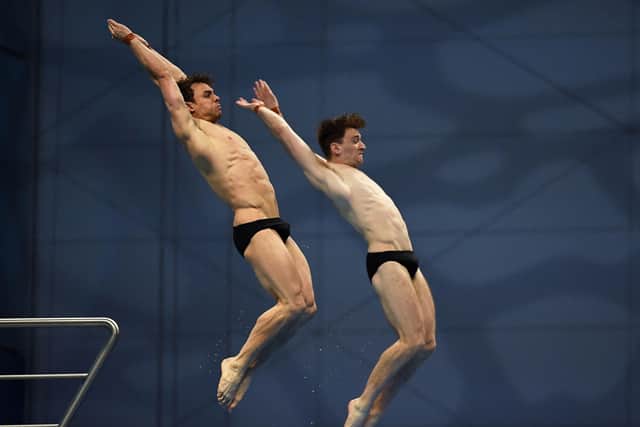 Great Britain's Thomas Daley (L) and Great Britain's Matthew Lee compete in the final en route to the gold medal. (Photo by Attila KISBENEDEK / AFP) (Photo by ATTILA KISBENEDEK/AFP via Getty Images)