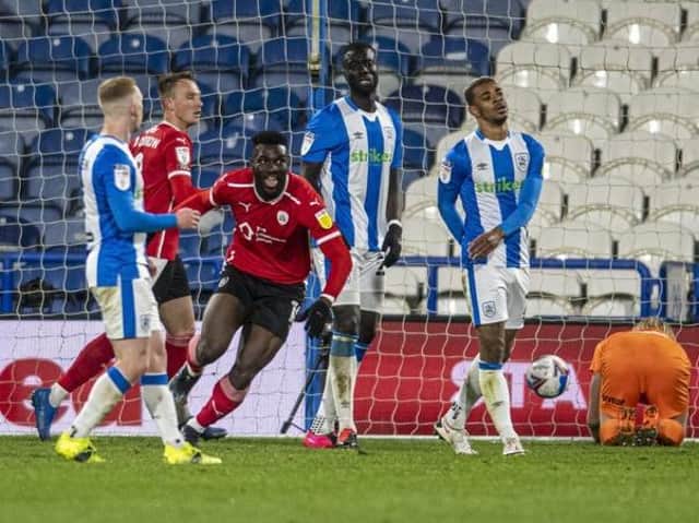 Barnsley FC striker Daryl Dike pictured celebrating after scoring in the 1-0 derby win at Huddersfield Town. Picture: Tony Johnson.