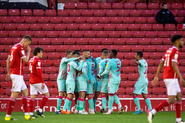 Swansea celebrates Andre Ayew's opening goal at Oakwell.  Picture: Bruce Rollinson