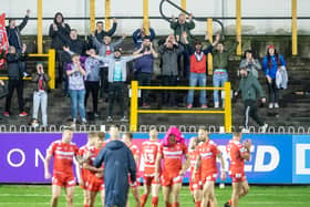 A handful of Hull KR fans who managed to get in tonight's restricted capacity game at Castleford Tigers celebrate their side's win. (ALLAN MCKENZIE/SWPIX)