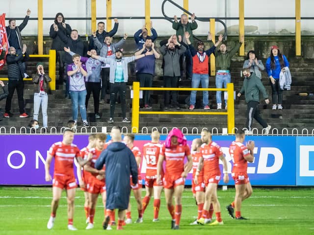 A handful of Hull KR fans who managed to get in tonight's restricted capacity game at Castleford Tigers celebrate their side's win. (ALLAN MCKENZIE/SWPIX)