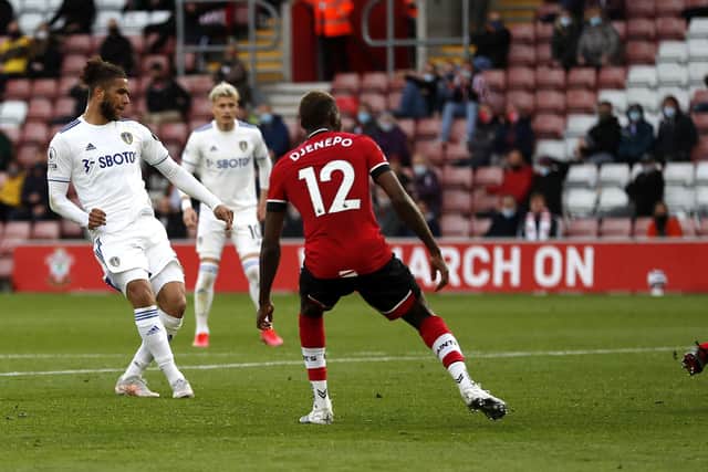 Leeds United's Tyler Roberts (left) scores his first Premier League goal.