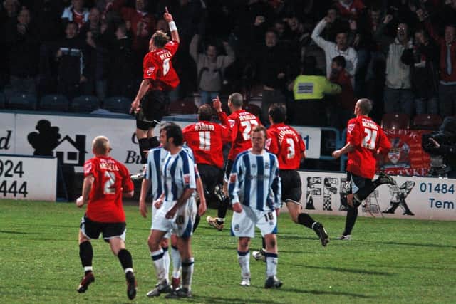 Spot on: Barnsley celebrate equalising from the penalty spot through Paul Hayes.