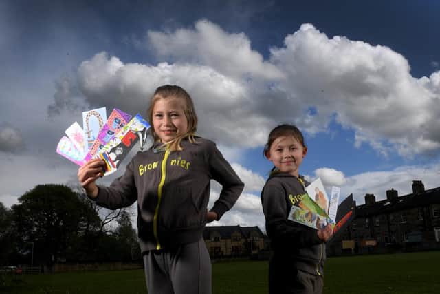 Claudia Lewis and Julia Sheriff from the 1st Burley Brownies group at Burley in Wharfedale with some of the bookmarks. Picture by Simon Hulme