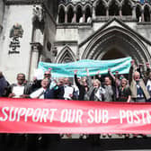 Former post office workers celebrating outside the Royal Courts of Justice, London, after their convictions were overturned by the Court of Appeal in April