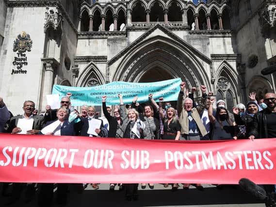 Former post office workers celebrating outside the Royal Courts of Justice, London, after their convictions were overturned by the Court of Appeal in April