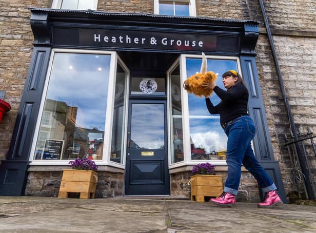 Roxy Cloughton with one of her All Creatures Great and Stuffed creations outside Heather & Grouse