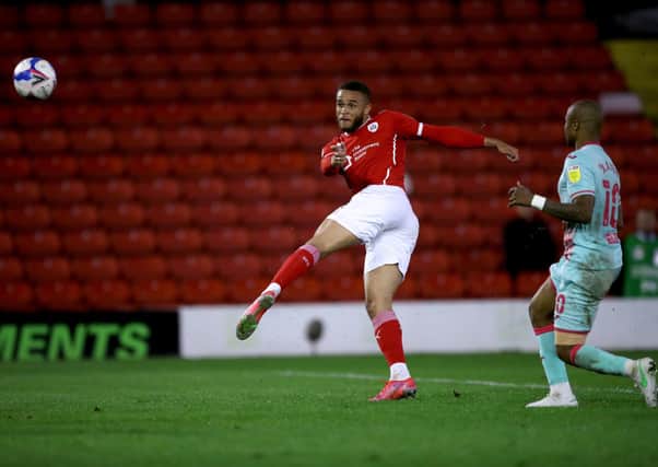 Making a difference: Barnsley's Carlton Morris attempts a shot during the first leg. Picture: PA