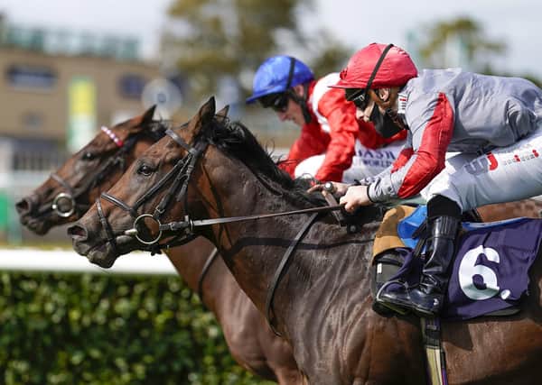 Rowan Scott riding Ubettabelieveit (number six) win The Bombardier Flying Childers Stakes during day three of the William Hill St Leger Festival at Doncaster Racecourse.