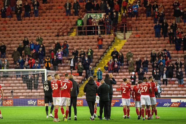 Barnsley's players applaud their fans after the 1-0 first leg defeat at Oakwell on Monday night - they hope to see them again at Wembley.  Picture: Bruce Rollinson