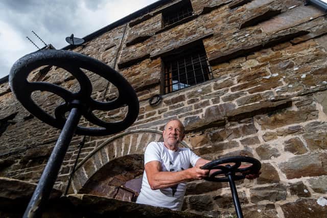 Neil McNair has restored the waterwheel at Low Mill Guest House, Bainbridge, Leyburn