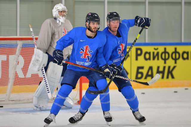 WARMING UP: Davey Phillips gets to grips with forward Liam Kirk in practice in Riga earlier this week. Picture: Dean Woolley.