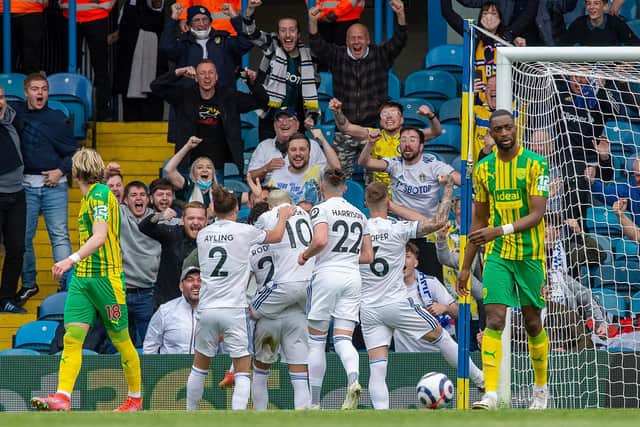 JOY: Leeds United players celebrate Rodrigo's opening goal in front of their supporters