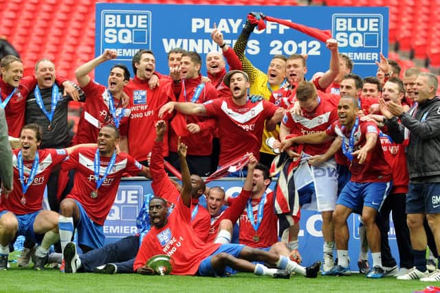 Going up: The 
Minstermen celebrate promotion.