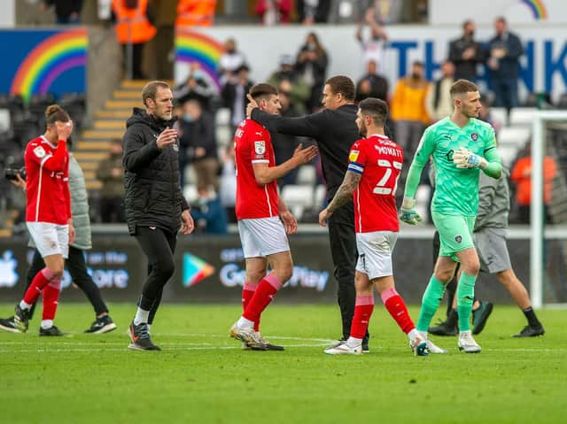Barnsley FC head coach Valerien Ismael consoles his players at the final whistle at Swansea. Picture: Bruce Rollinson.