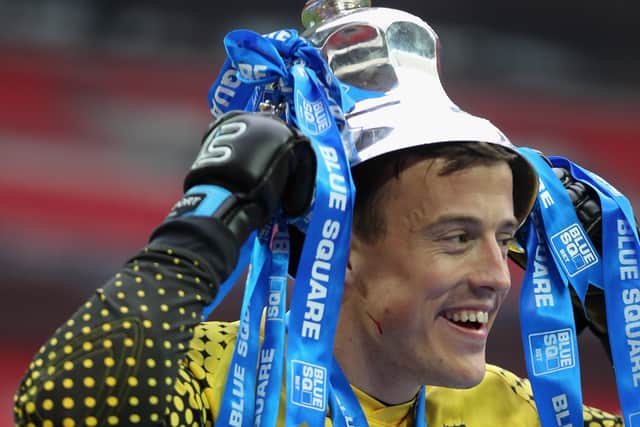 If the cup fits:  Michael Ingham celebrates promotion to the Football League. Picture: Getty Images