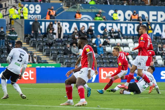 SO CLOSE: Cauley Woodrow scores for Barnsley at the Liberty Stadium. Picture: Bruce Rollinson.