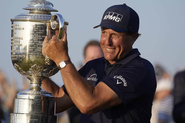 Trophy time: Phil Mickelson holds the Wanamaker Trophy.