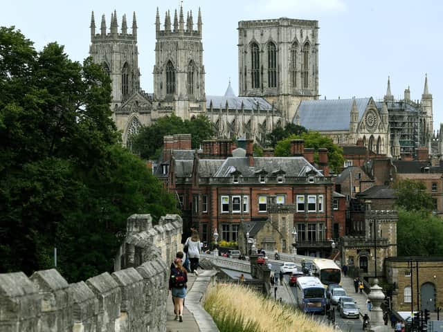 Visitors take a walk along York's city walls