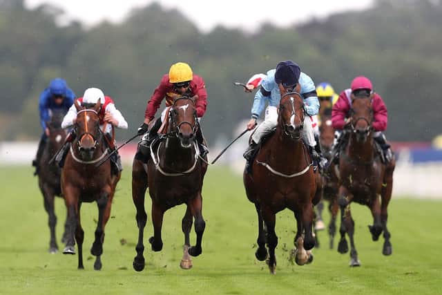 Gear Up ridden by jockey Silvestre De Sousa (centre left yellow helmet) on the way to winning the Tattersalls Acomb Stakes during day one of the Yorkshire Ebor Festival at York Racecourse last August.