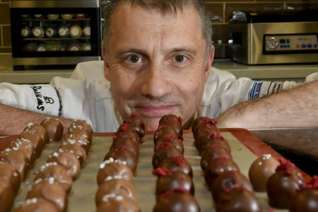 Chocolatier Andrew Thwaite from York Cookery School   with some of his  salted caramrl milk chocolates and dark chocolate  cherry brandy chocs.  Picture: Gary Longbottom