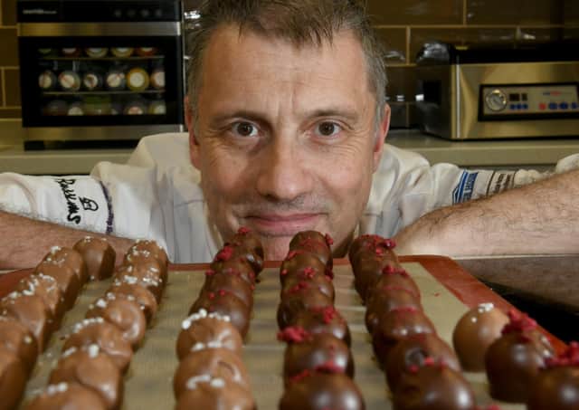 Chocolatier Andrew Thwaite from York Cookery School   with some of his  salted caramrl milk chocolates and dark chocolate  cherry brandy chocs.  Picture: Gary Longbottom