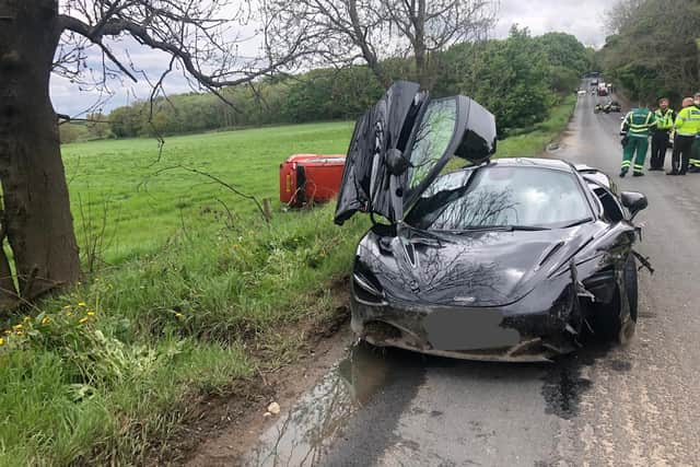The driver of the black McLaren 720S Spider tried to overtake another car in Huddersfield. Photo: West Yorkshire Police.