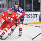 CAPTAIN FANTASTIC: Jonathan Phillips battles for the puck against Russia in Riga. Picture: Dean Woolley.