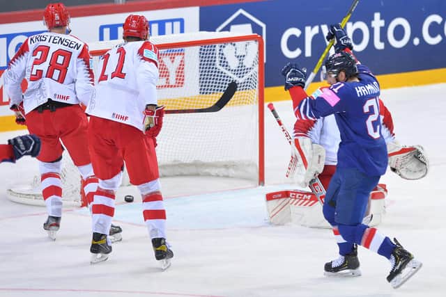 Mike Hammond, right, tuyrns away to celebrate his late equaliser which earned GB their first point of the World Championships in Riga. Picture: Dean Woolley.