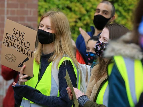 Students at a campus rally to support the archaeology department this week