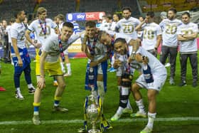 Leeds United's  Illan Meslier, Ben White, Kalvin Phillips and Tyler Roberts with the Championship trophy at Elland Road in 2020. Picture Tony Johnson