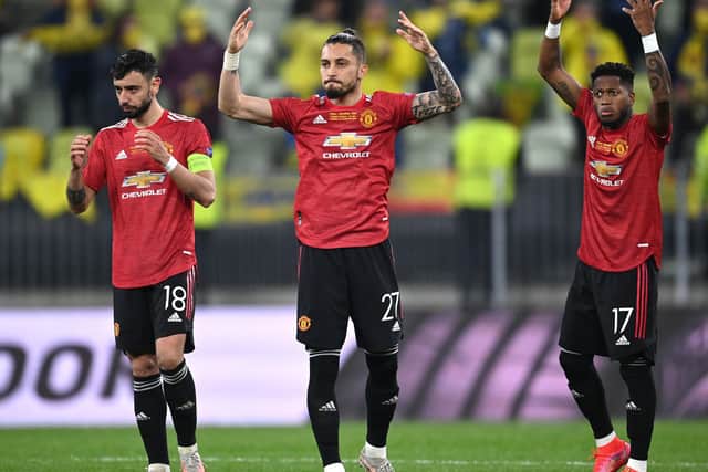 Manchester United's Bruno Fernandes (left), Alex Telles (centre) and Fred gesture to the fans during the UEFA Europa League final, at Gdansk Stadium, Poland. (Picture: PA)